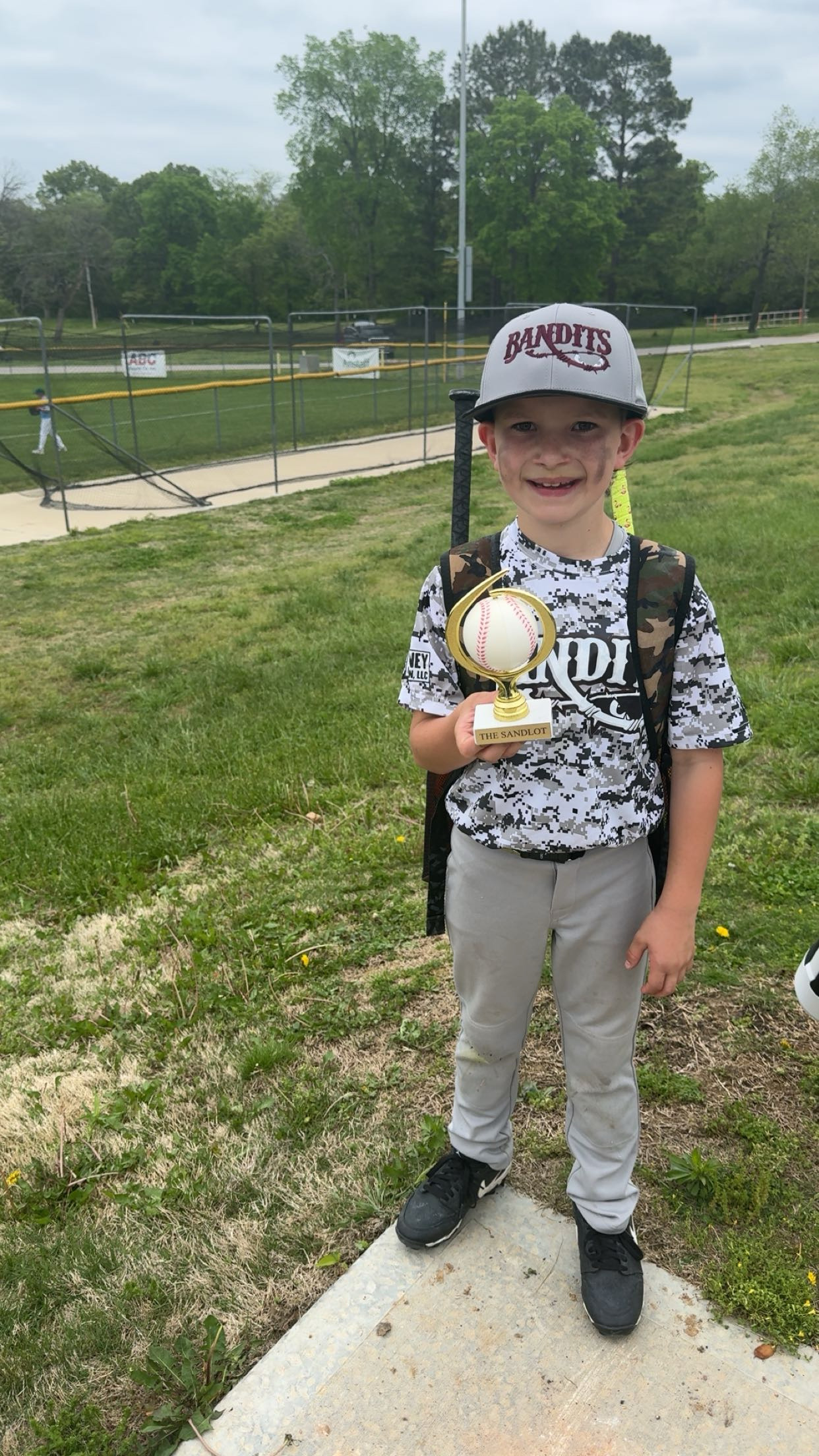 little boy holding a baseball