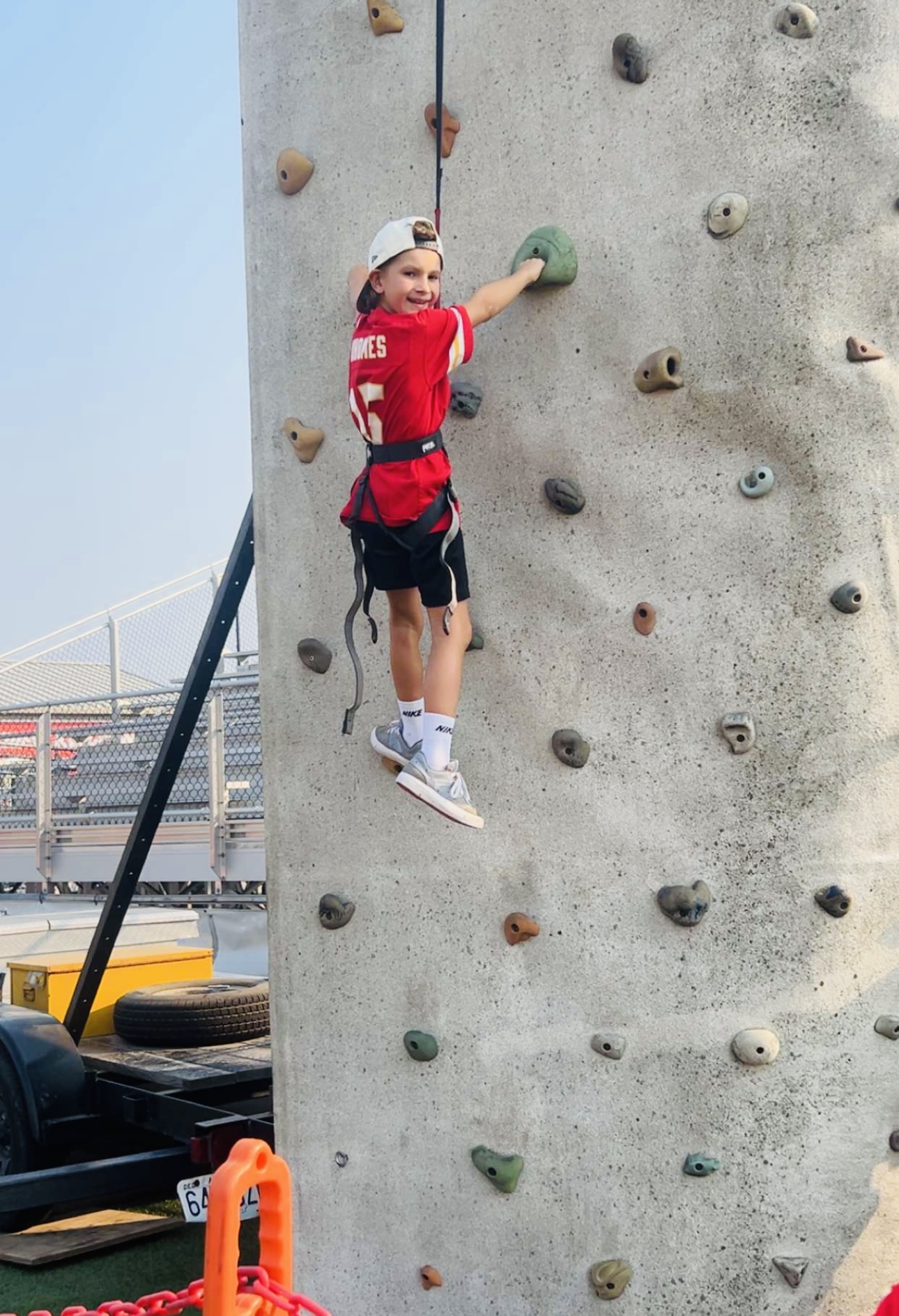 Little boy wall climbing